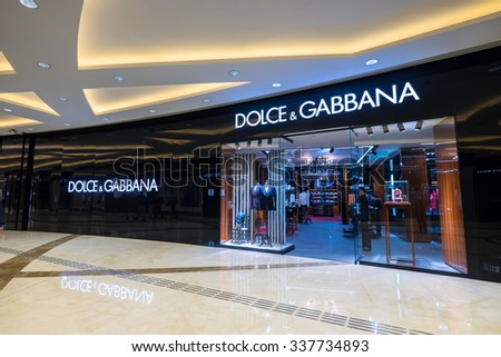 HONG KONG - 22 JAN, 2015: Dolce Gabbana fashion boutique display window with mannequin in luxury clothes and accessories. Founded in 1985 by Italian designers Domenico Dolce and Stefano Gabbana