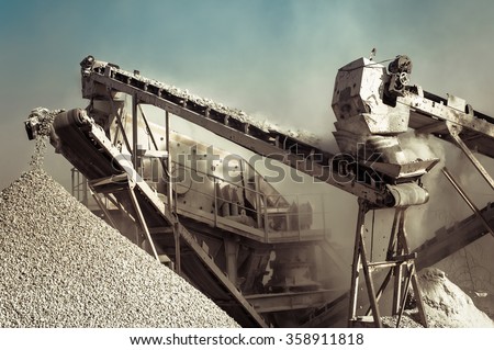 Industrial background with working gravel crusher