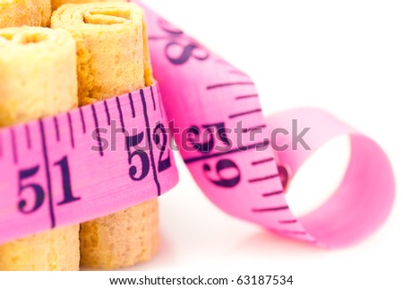 Unhealthy food: Sweet candy cakes rounded inch scale measuring tape