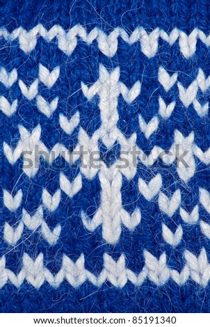 Knit woolen texture. Fabric blue and white background