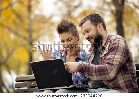 Young Urban People Outdoor Using Computer Laptop