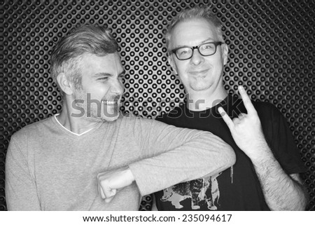 Two Older Urban Men Having Fun in Studio