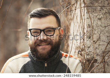 Man With Beard And Glasses Posing