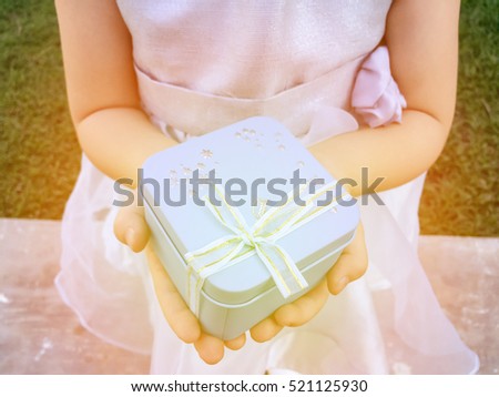 Gift box on girl\'s hands .Blue box in girl\'s hand.Surprise gift box.