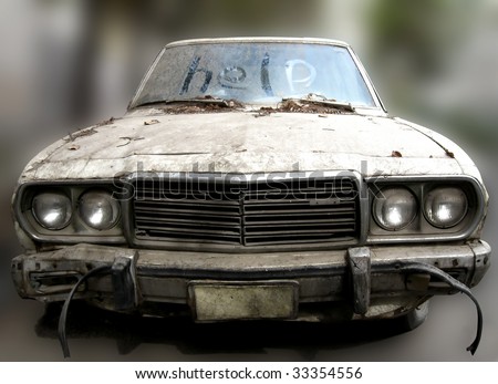 HELP written on windshield of an abandoned car