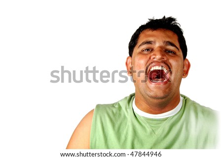 A young boy laughing out very loud opening his mouth joyously with white background