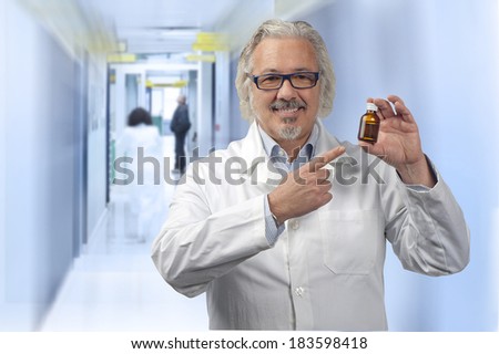 caucasian mature male doctor on out of focus background