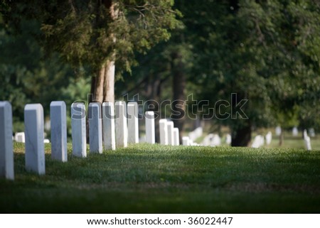 tombs at Arlington Cemetery in Washington DC (with the Memorial for J.F. Kennedy)