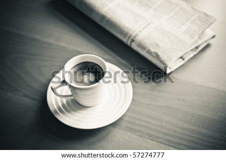 cup of Espresso and newspaper, vintage monochrome
