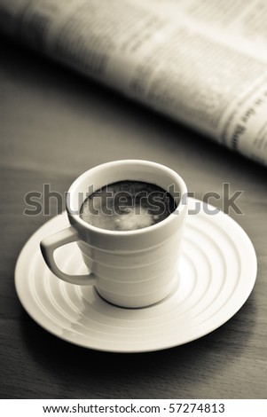 cup of Espresso and newspaper, vintage monochrome