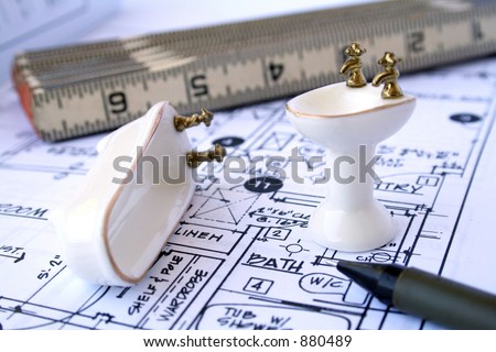 Designing bathroom - blueprint, ruler, mechanical pencil and miniature bathtub and sink