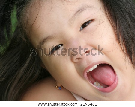 Three Year Old Asian Making Face