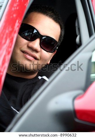 Young Asian Male inside the Car