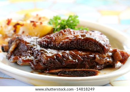 Baby Back Ribs and Baked Potatoes