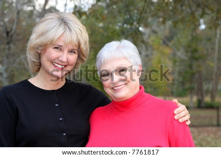 beautiful woman embraces her elderly mother