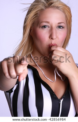 pretty blond referee blowing a whistle.