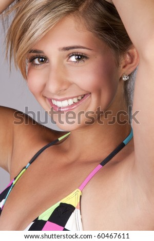 stock photo a pretty blond young teen girl wearing a colorful bikini