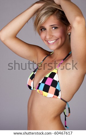 stock photo a pretty blond young teen girl wearing a colorful bikini
