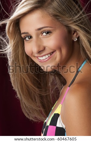 stock photo a pretty blond young teen girl wearing a colorful bikini