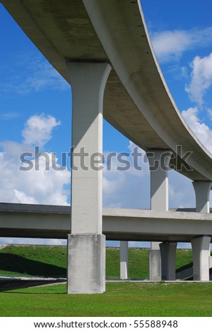 South Florida expressway with blue skies and green grass.