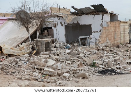 SEREKANIYE, SYRIA-MARCH 22: View of war damage from Serekaniye. Syrian war plane bombed Serekaniye. The Photo Taken, March 22, 2013.
