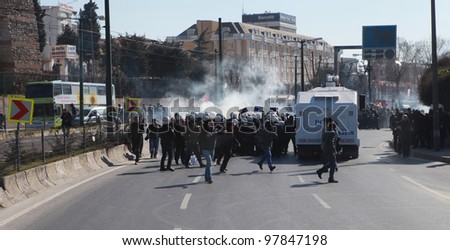 ISTANBUL - MARCH 18: Turkish police released gas bomb in Newroz in Topkapil. Kurds celebrating their traditional feast Newroz that means \'new day\' in kurdish on March 18, 2012 in Istanbul, Turkey.