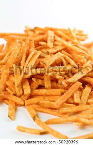 Potato chips sticks with ketchup flavor isolated on white background