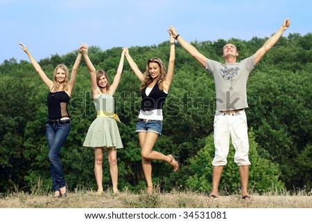 group of young people go for a walk on nature