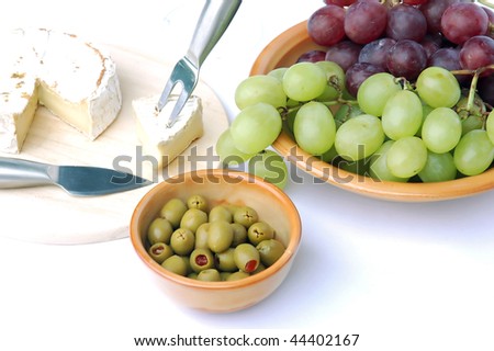 stock photo : Ripened cheese, olives and grapes