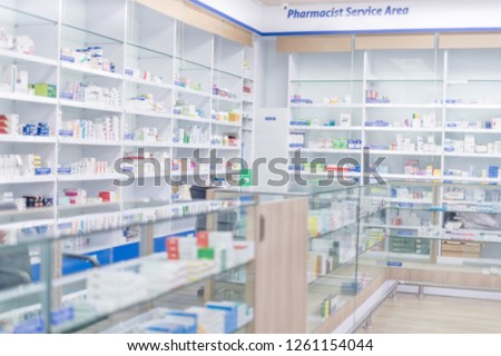Medicines arranged in shelves, Pharmacy drugstore retail Interior blur abstract backbround with healthcare product on medicine cabinet.