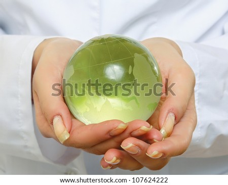 doctor holding plant earth in her hands