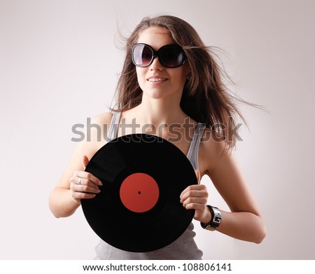 girl with vinyl disc closeup