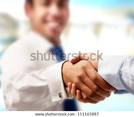 Closeup of a business handshake isolated on white Closeup of a business handshake isolated on white