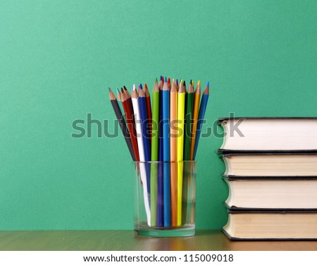 books and pencils on the desk