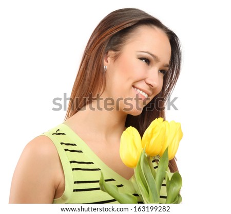 happy woman with yellow tulips over white background