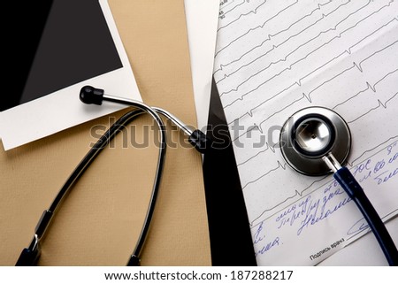 File folder with blank label for text and medical stethoscope