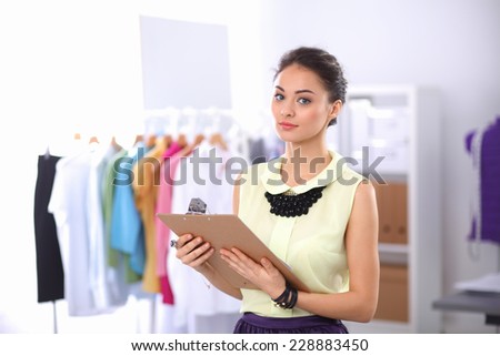 Modern young fashion designer working at studio.isolated