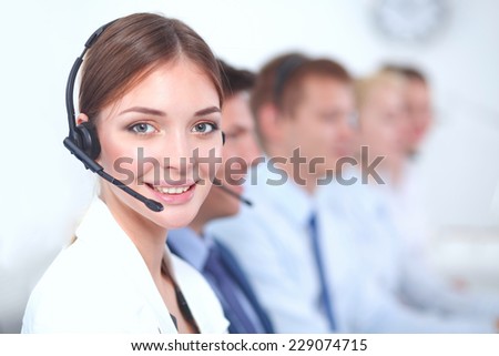 Attractive  positive young businesspeople and colleagues in a call center office