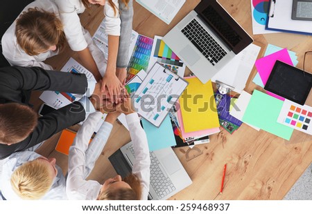 Business team with hands together - teamwork concepts, isolated