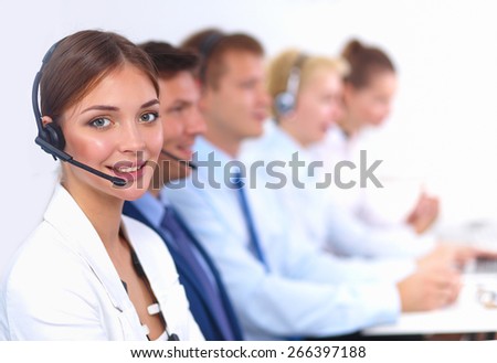 Attractive  positive young businesspeople and colleagues in a call center office