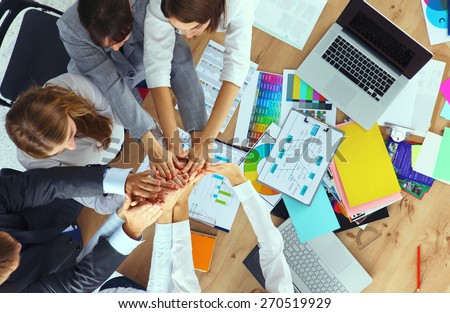 Business team with hands together - teamwork concepts.