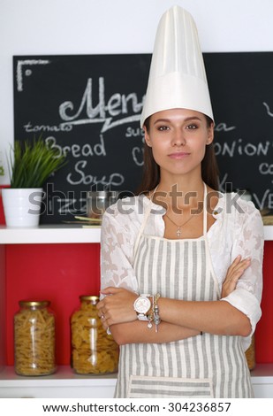 Chef woman portrait with  uniform in the kitchen .