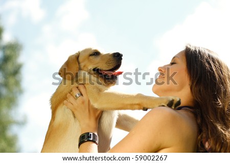Girl with her dog resting outdoors