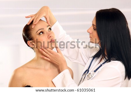 Medical examination face of beautiful woman by beautiful doctor