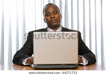 african amercian businees man working on his laptop