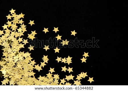 Gold stars on black background
