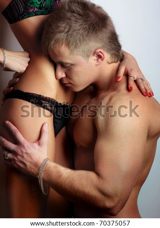 couple heterosexual topless with jeans detail studio shot