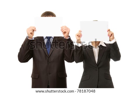 Business people with empty blanks hiding their faces