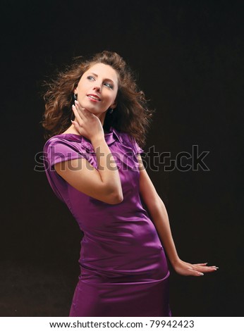 Portrait of a beautiful young sexy woman, isolated on a dark background