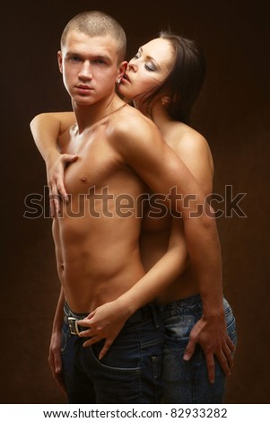 couple heterosexual topless with jeans detail studio shot